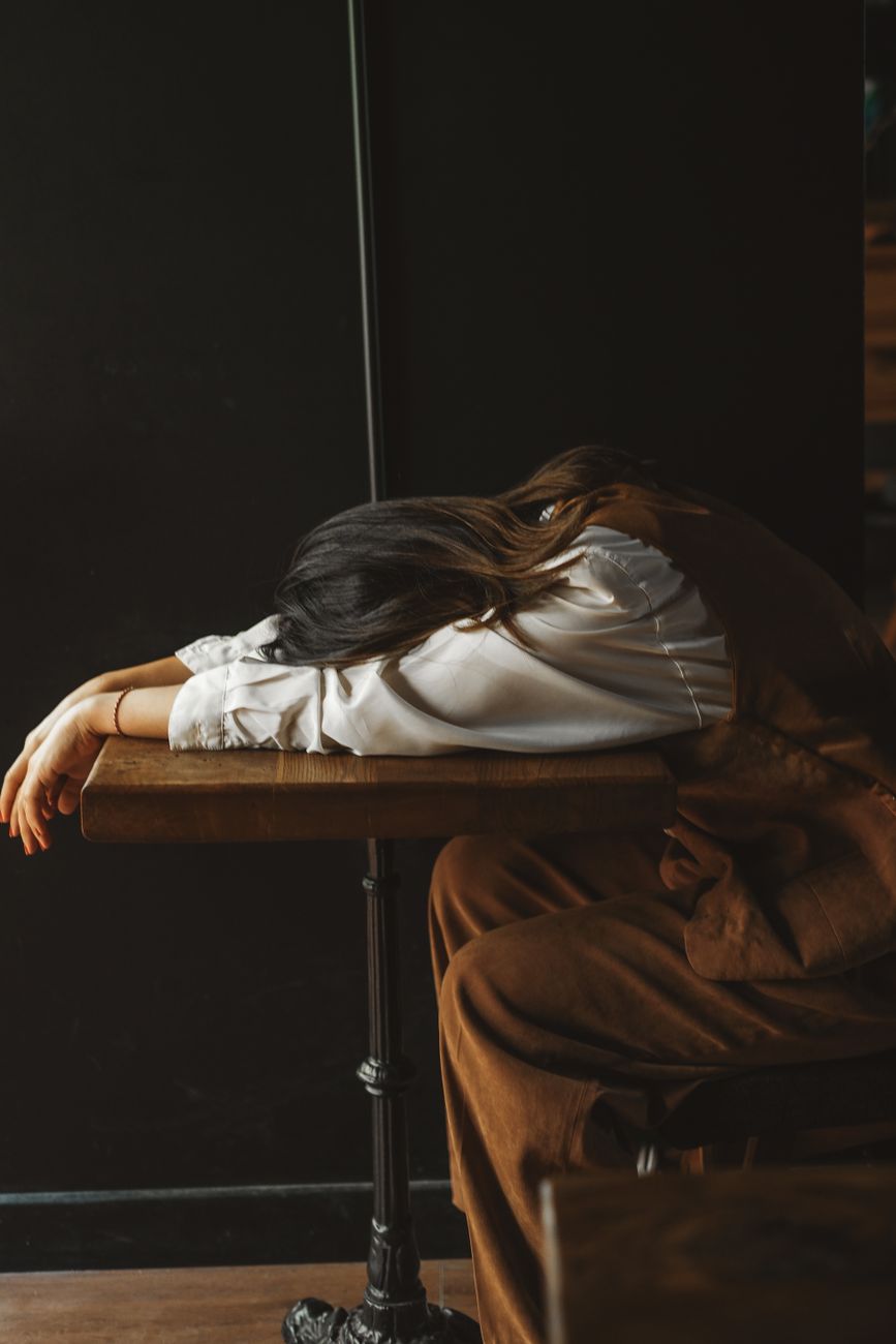 woman lying on table in bar